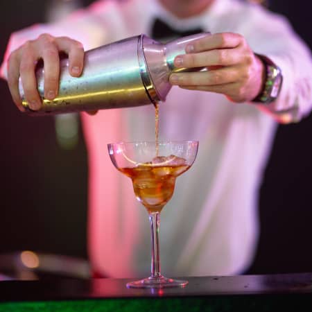 Craft cocktail being poured