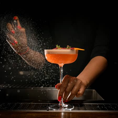 Mixologist preparing fancy cocktail