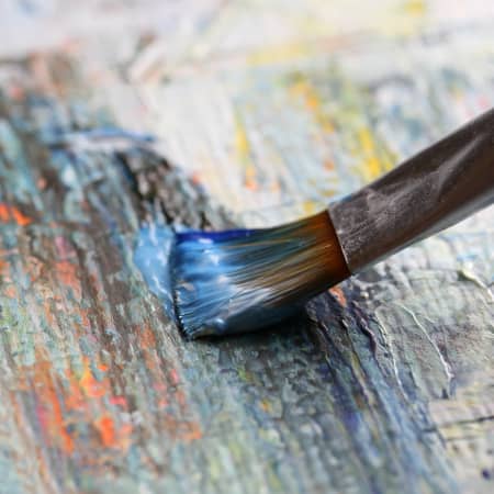 Paintbrush on modern art piece