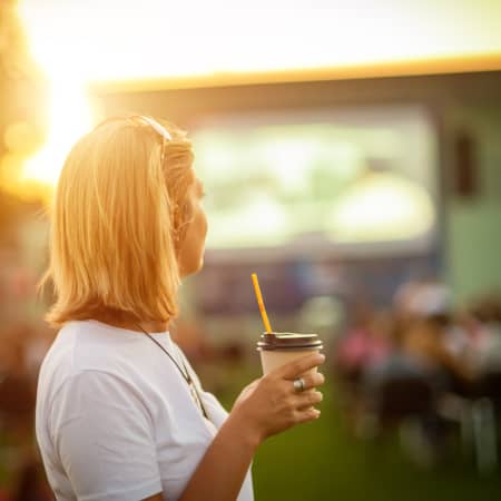 Woman watching movie outdoors