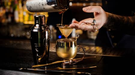 Cocktail being poured at a speakeasy