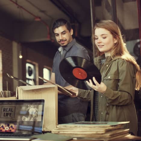 Couple vinyl record shopping on a date