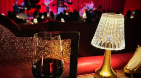 Wine glass prominent at a jazz show