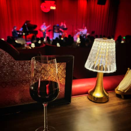 Wine glass prominent at a jazz show