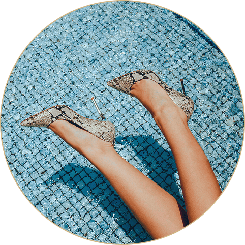 Woman wearing fancy shoes in a pool