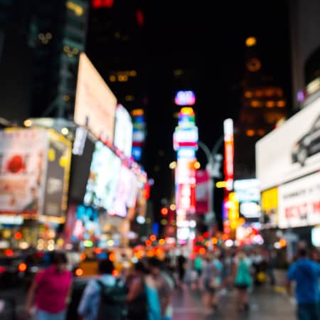 Broadway, blurred, at night