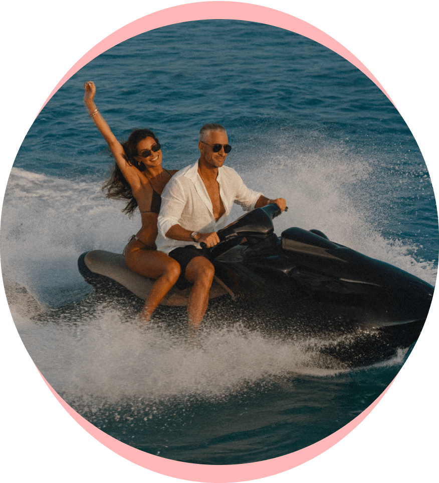 Couple riding on a Jetski in a lake